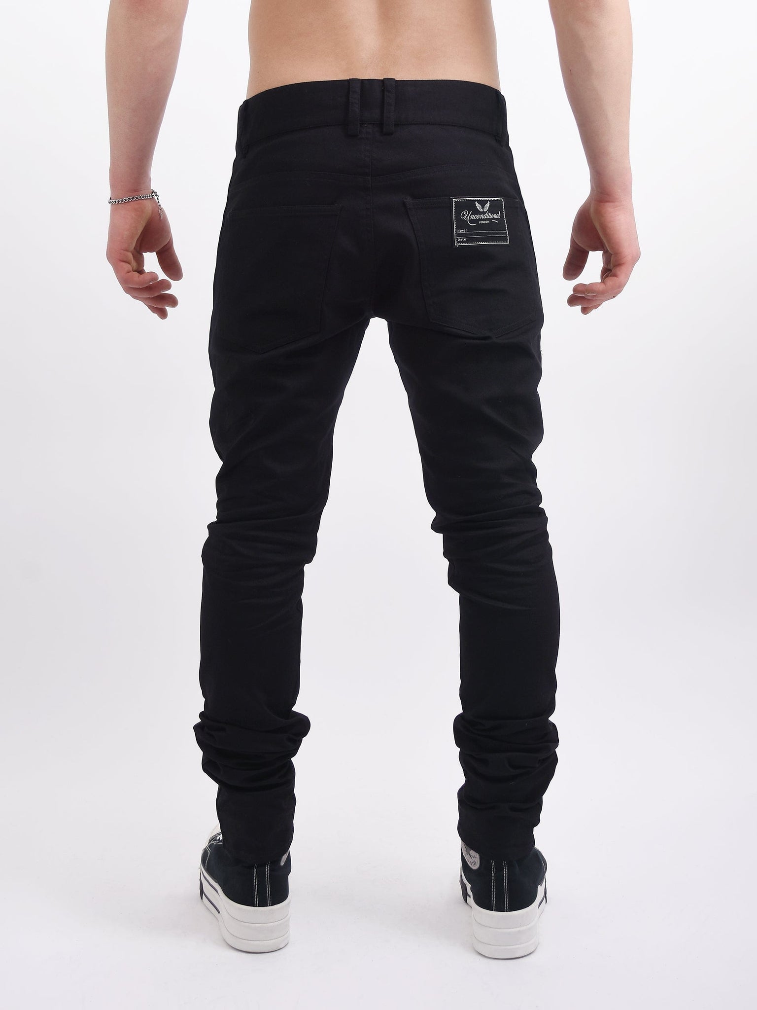 Shops black satin jeans